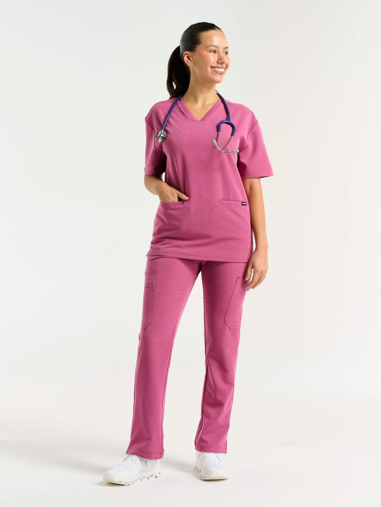 front view of red violet v neck scrub top